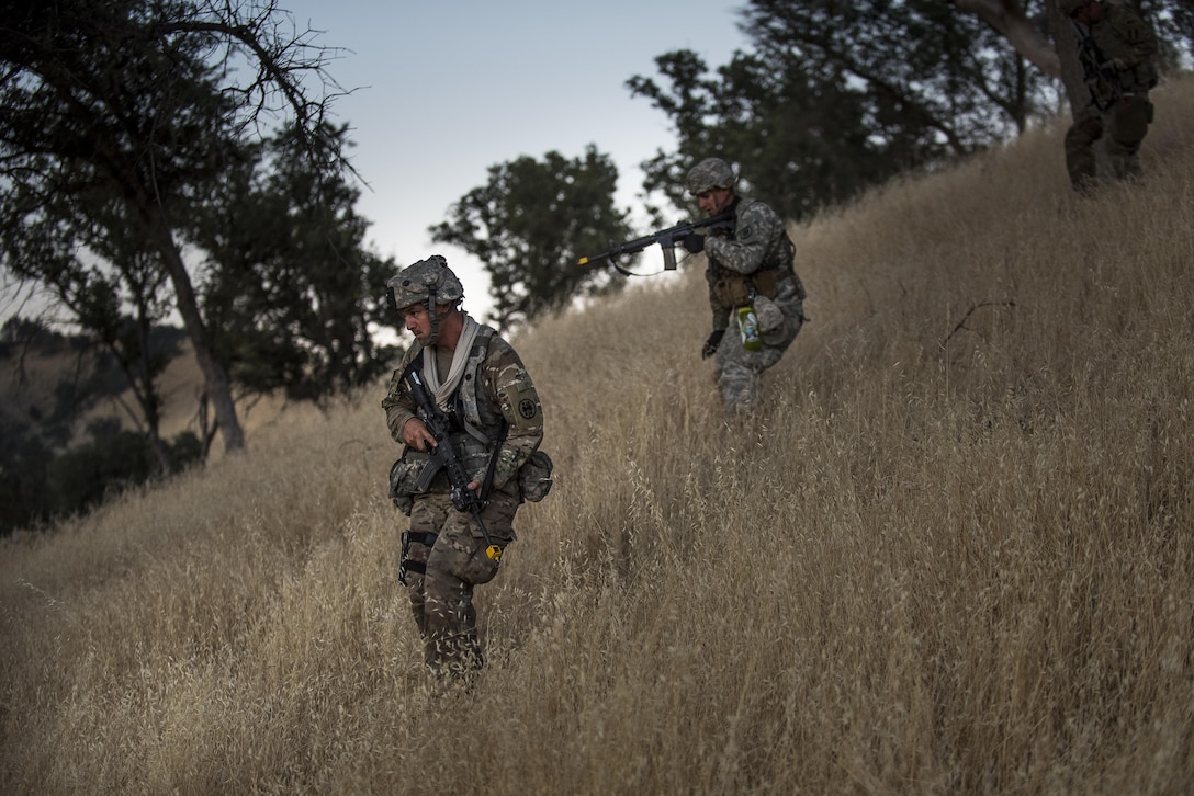 U.S. Army Reserve military police Soldiers from the 56th Military Police Company climb down a hill on a reconnaissance patrol the night before a morning mission during a Combat Support Training Exercise (CSTX) at Fort Hunter Liggett, California, July 22, 2017. (U.S. Army Reserve photo by Master Sgt. Michel Sauret)