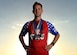 U.S. Air Force Tech. Sgt. Logan Berry, 54th Air Refueling Squadron instructor boom operator, poses while wearing his long-distance running medals, July 20, 2017 at Altus, Oklahoma. After an unsuccessful running portion of a physical training test, Berry motivated himself to become a better runner and has competed in several long-distance running events, including the Air Force Marathon. (U.S. Air Force photo by Senior Airman Kirby Turbak/Released)