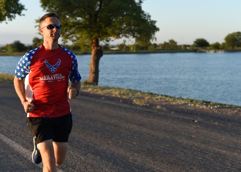 U.S. Air Force Tech. Sgt. Logan Berry, 54th Air Refueling Squadron instructor boom operator, trains in preparation for his next marathon, July 20, 2017 at Altus, Oklahoma. After an unsuccessful running portion of a physical training test, Berry motivated himself to become a better runner and has competed in several long-distance running events, including the Air Force Marathon. (U.S. Air Force photo by Senior Airman Kirby Turbak/Released)