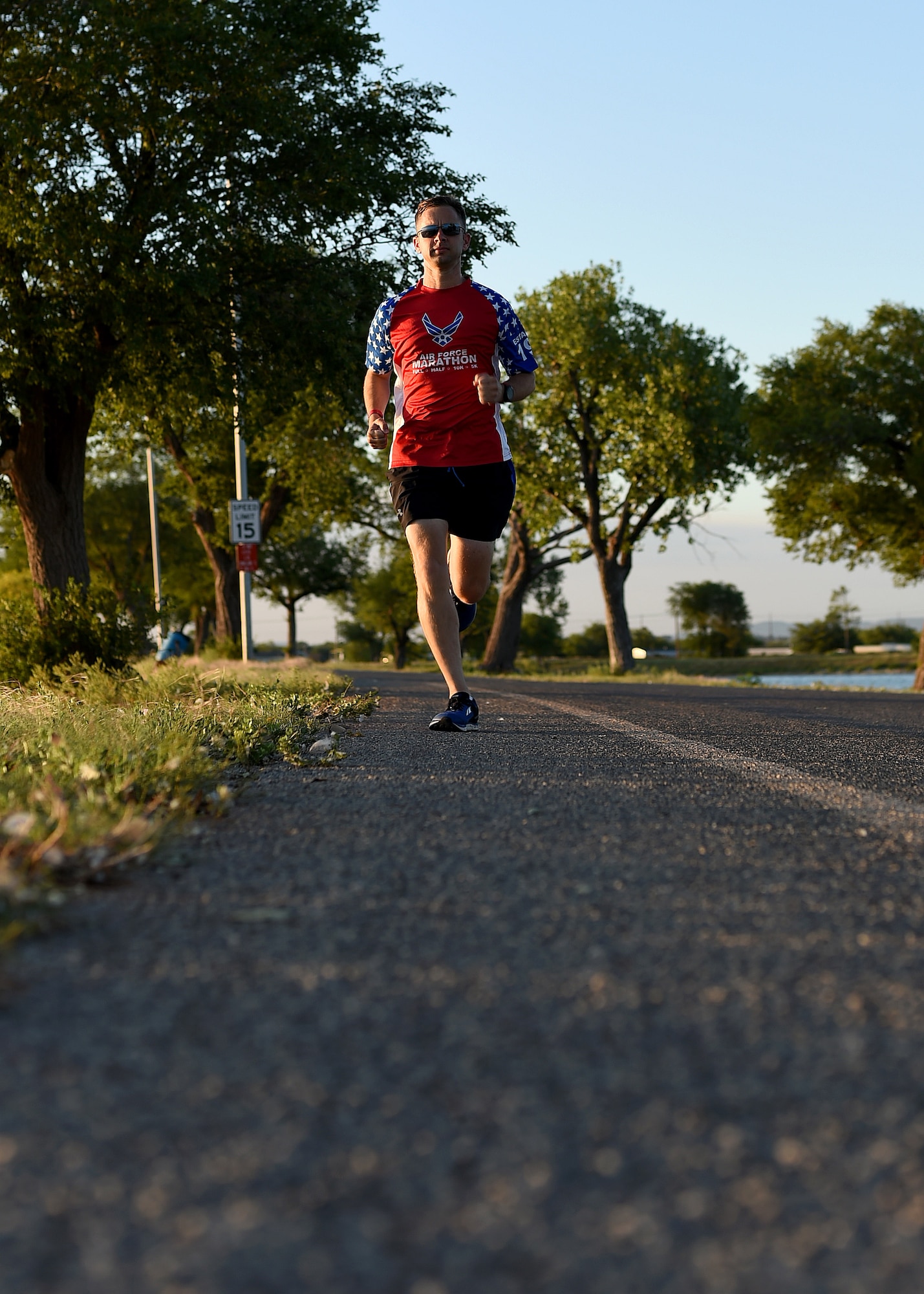 U.S. Air Force Tech. Sgt. Logan Berry, 54th Air Refueling Squadron instructor boom operator, paces himself while running, July 20, 2017 at Altus, Oklahoma. After an unsuccessful running portion of a physical training test, Berry motivated himself to become a better runner and has competed in several long-distance running events, including the Air Force Marathon. (U.S. Air Force photo by Senior Airman Kirby Turbak/Released)