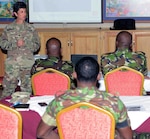 Col. Claudia Carrizales, U.S. Southern Command's military liaison officer to Trinidad and Tobago, talks to participants during the final day of a bi-lateral energy and water policy development subject matter expert exchange in Port of Spain, Trinidad, July 13.