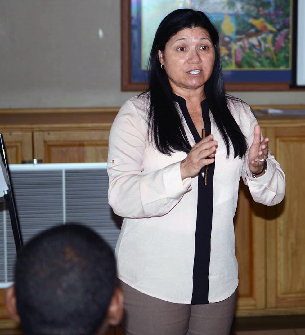 Rosa Santoni, Army South's facility and construction chief, addresses participants during day two of a subject matter expert exchange in Port of Spain, Trinidad, July 12. 