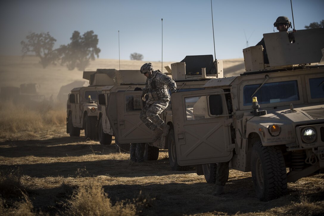 A U.S. Army Reserve military police gunner dismounts a humvee before a convoy during a Combat Support Training Exercise (CSTX) at Fort Hunter Liggett, California, July 22, 2017. (U.S. Army Reserve photo by Master Sgt. Michel Sauret)