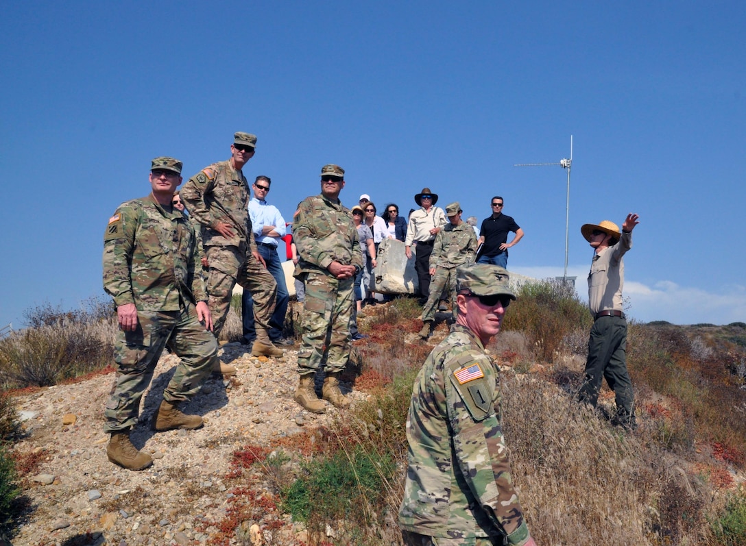 Chris Peregrine (r), California State Parks, describes how sediment flow adversely impacts the environment in Goat Canyon and and Borderfield State Park and stresses the necessity for federal, state and local agency cooperation to address the issues.
