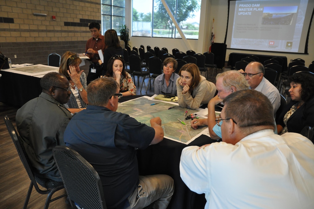 Corps archeologist Danielle Storey (center) facilitates discussion among representatives from flood control and water conservation districts, public works and utilities agencies, parks departments and the cities of Corona and Eastvale to ensure their concerns are considered in the update.
