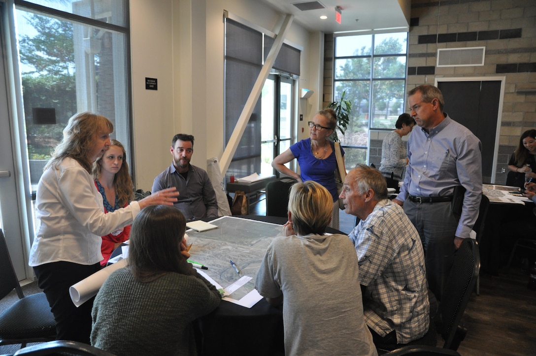 Corps biologist Hayley Lovan (standing at left) explains some of the environmental concerns that affect proposed projects within the basin.
