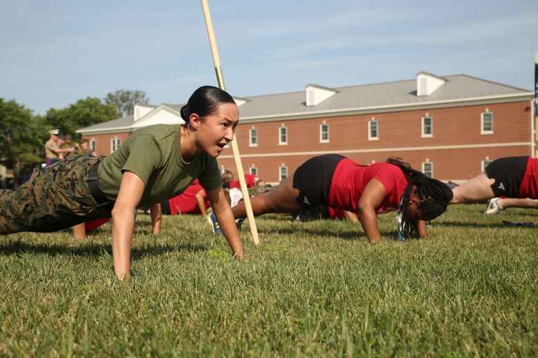Sgt. Guadalupe Campos, the marketing and public affairs representative for Recruiting Station San Antonio, performs push-ups during a physical training session as part of the inaugural Battles Won Academy on Marine Corps Base Quantico, Virginia, July 14, 2017. The Battles Won Academy is a part of the Marine Corps’ Semper Fidelis All-American Program, which recognizes young men and women who excel in athletics, but have also shown themselves to be leaders in the classroom and in their hometowns. Ninety-seven high school student-athletes attended the academy, which focused on developing their self-confidence, discipline, teamwork, and honing the fighting spirit that embodies the Marine Corps. (U.S. Marine Corps photo by Sgt. Bryan Nygaard/Released)