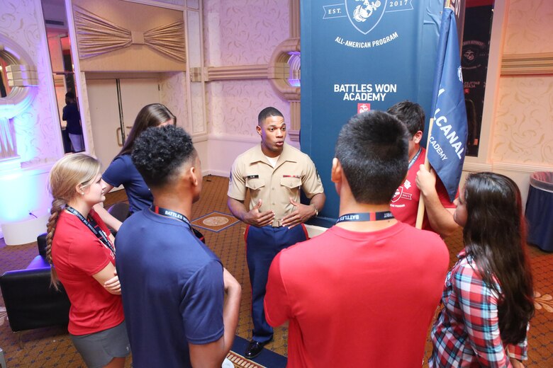 Sgt. Steven Else, Jr., a canvassing recruiter with Recruiting Station Lansing, Michigan, speaks with his team during the first day of the inaugural Battles Won Academy, July 13, 2017, in Washington D.C. The Battles Won Academy is a part of the Marine Corps’ Semper Fidelis All-American Program, which recognizes young men and women who excel in athletics, but have also shown themselves to be leaders in the classroom and in their hometowns. Ninety-seven high school student-athletes attended the academy, which focused on developing their self-confidence, discipline, teamwork, and honing the fighting spirit that embodies the Marine Corps. (U.S. Marine Corps photo by Sgt. Bryan Nygaard/Released)