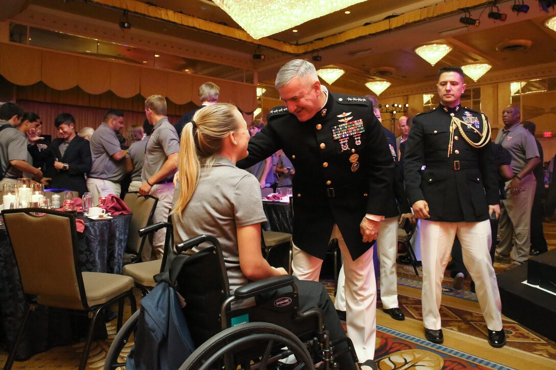 Gen. Glenn M. Walters, the assistant commandant of the Marine Corps talks with Bailey Bish, a Semper Fidelis All-American, during the closing ceremonies of the Battles Won Academy in Washington D.C., July 16, 2017. The Battles Won Academy is a part of the Marine Corps’ Semper Fidelis All-American Program, which recognizes young men and women who excel in athletics, but have also shown themselves to be leaders in the classroom and in their hometowns. Ninety-seven high school student-athletes attended the academy, which focused on developing their self-confidence, discipline, teamwork, and honing the fighting spirit that embodies the Marine Corps. (U.S. Marine Corps photo by Sgt. Bryan Nygaard/Released)