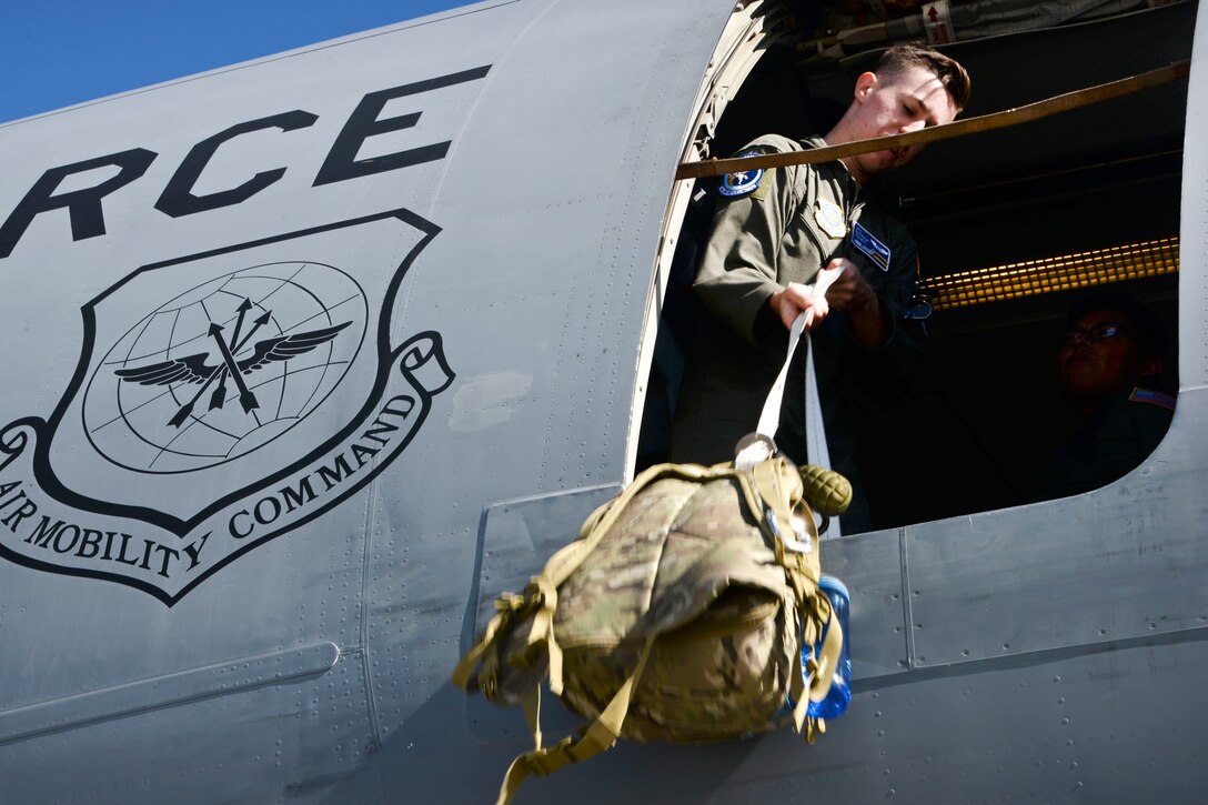 Air Force Airman 1st Class Patrick Tracy loads aircrew equipment onto a KC-10 Extender aircraft before a mission at Royal Australian Air Force Base Richmond in Brisbane, Australia, July 14, 2017. Tracy is a boom operator assigned to the 6th Air Refueling Squadron from Travis Air Force Base, California. Air Force photo by 2nd Lt. Sarah Johnson  