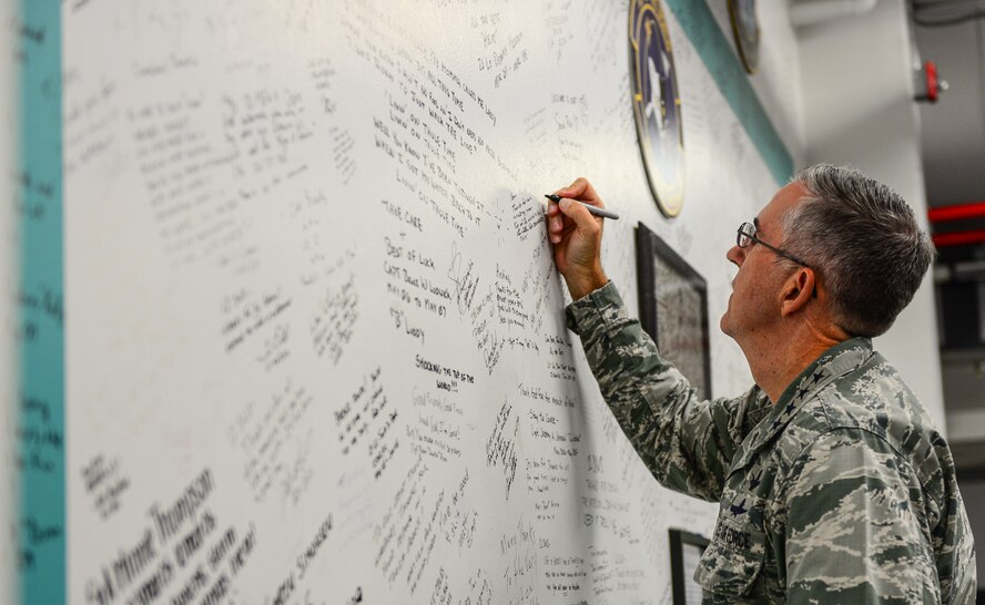 Gen. John Hyten, U.S. Strategic Command commander, signs the 12th Space Warning Squadron Wall during a visit to Thule Air Base, Greenland, July 17, 2017. Hyten and his wife, Laura, visited with Airmen during a visit to Thule AB at an all call and lunch at 12th SWS. The 12th SWS was established in 1961 and today operates a Ballistic Missile Early Warning System. (U.S. Air Force photo by Capt. Md Hussain)