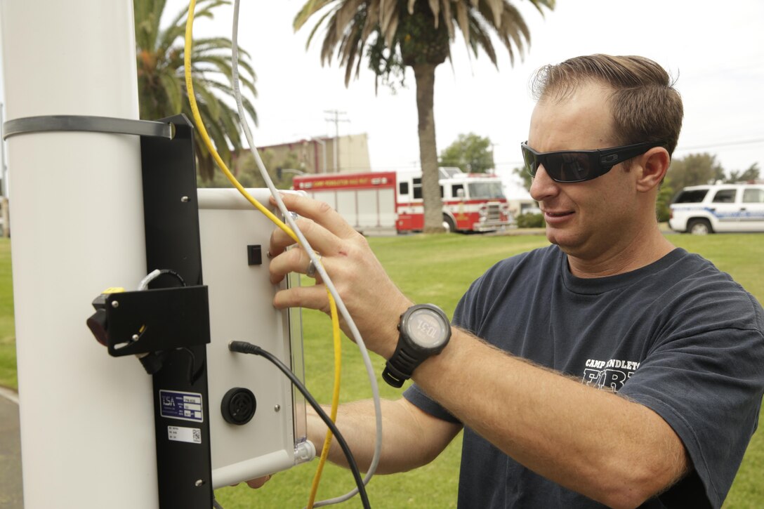 Camp Pendleton firefighter Rusty Duke adjusts a radiation portal during the fire department's annual hazardous materials training on July 19, 2017. Annual hazardous materials training ensures Camp Pendleton's readiness in case of a HAZMAT emergency. (U.S. Marine Corps photo by LCpl. Lukas Kalinauskas)
