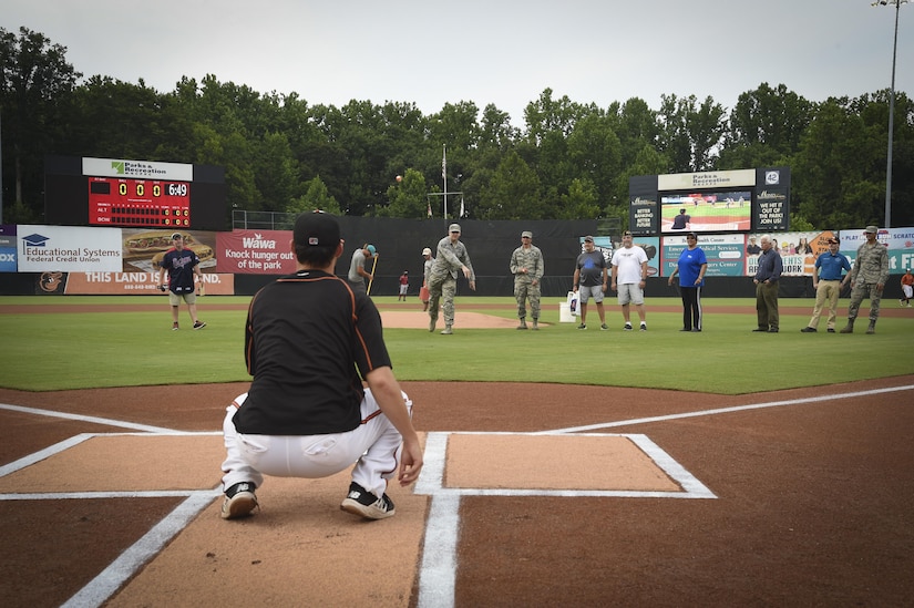 Several Airmen throw the ceremonial first pitch during Joint Base Andrews Military Appreciation Night hosted by the Bowie Baysox at the Prince George’s Stadium, in Bowie, Md., July 21, 2017. Several military members participated in opening ceremonies including the presenting of the colors, singing the national anthem, and throwing out the ceremonial first pitch. (U.S. Air Force photo by Senior Airman Mariah Haddenham)