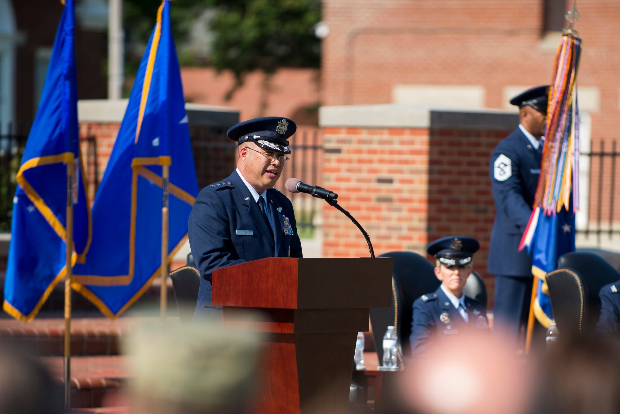 Lt. Gen. Giovanni Tuck, 18th Air Force commander, speaks during the 375th Air Mobility Wing change of command ceremony July 24, 2017, at Scott Air Force Base, Ill. The ceremony saw command of the wing transfer from Col. Laura Lenderman to Col. John Howard. (U.S. Air Force photo by Staff Sgt. Clayton Lenhardt)
