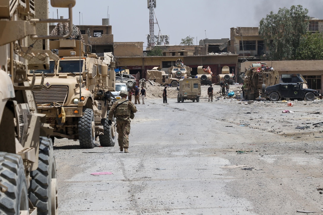 U.S. soldiers deployed in support of Combined Joint Task Force Operation Inherent Resolve and assigned to the 2nd Brigade Combat Team, 82nd Airborne Division, meet up with their Iraqi partners in a recently liberated neighborhood in western Mosul, July 2, 2017. Army photo by Staff Sgt. Jason Hull