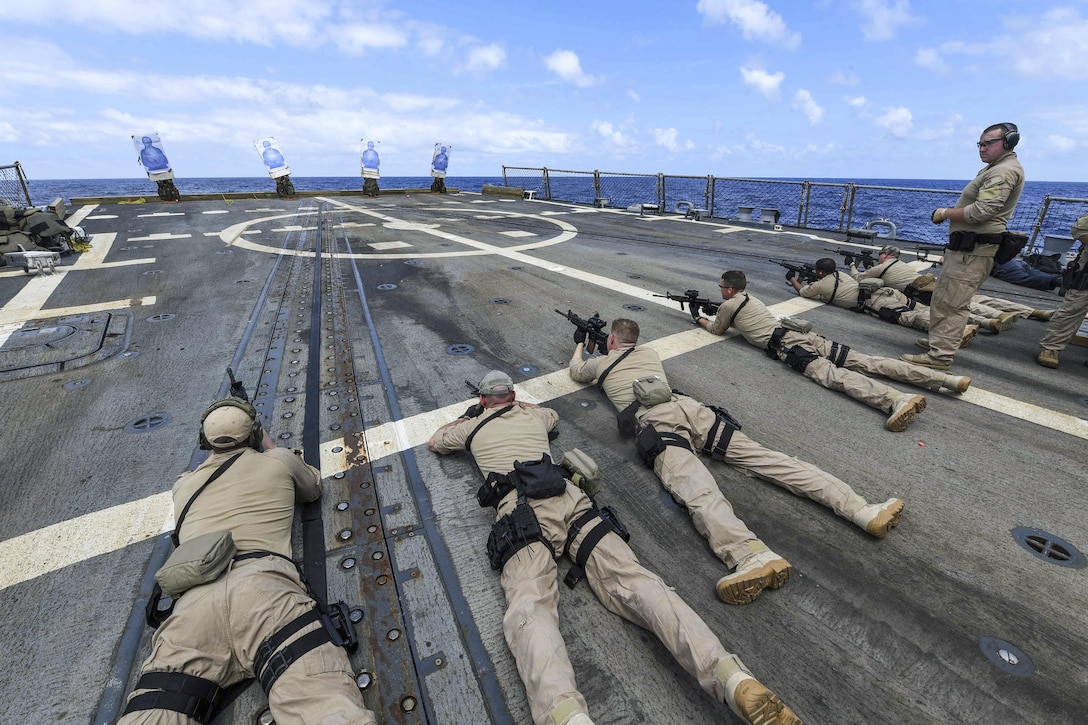 Sailors fire weapons as they participate in a visit, board, search and seizure team qualification on the USS James E. Williams in the Atlantic Ocean, July 21, 2017. The Williams is deployed to the U.S. 6th Fleet area of operations to support U.S. national security interests in Europe. Navy photo by Petty Officer 3rd Class Colbey Livingston