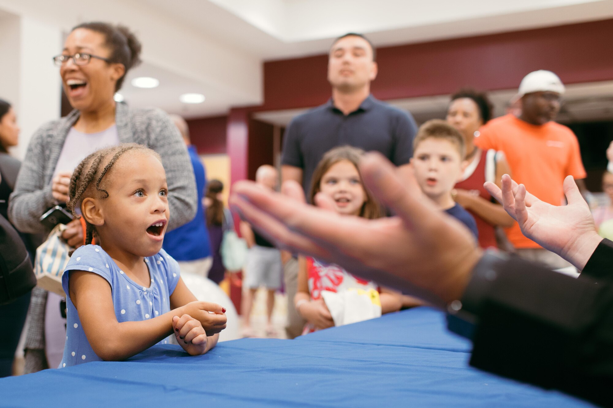 Magician Mike Super speaks with an audience member during a meet and greet at Joint Base Andrews, Md., July 21, 2017. Super was a finalist on NBC-TV’s “America’s Got Talent” in 2014 and earned the International Magician’s Society Performing Arts Entertainer of the Year Award in 2011 and 2012. (U.S. Air Force photo by Senior Airman Delano Scott)