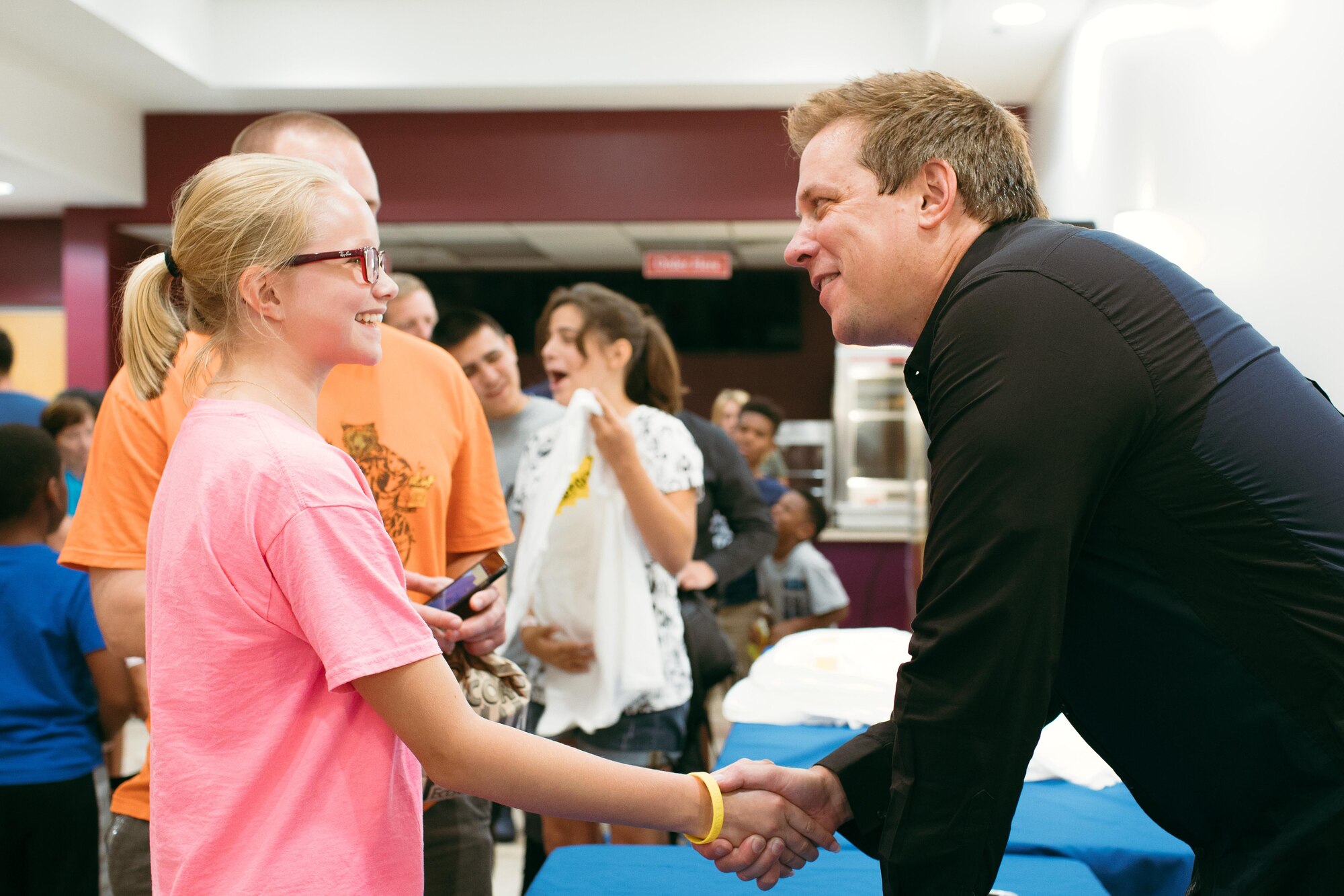 Mike Super shakes hands with an audience member during a meet and greet at Joint Base Andrews, Md., July 21, 2017. Super was a finalist on NBC-TV’s “America’s Got Talent” in 2014 and earned the International Magician’s Society Performing Arts Entertainer of the Year Award in 2011 and 2012. (U.S. Air Force photo by Senior Airman Delano Scott)