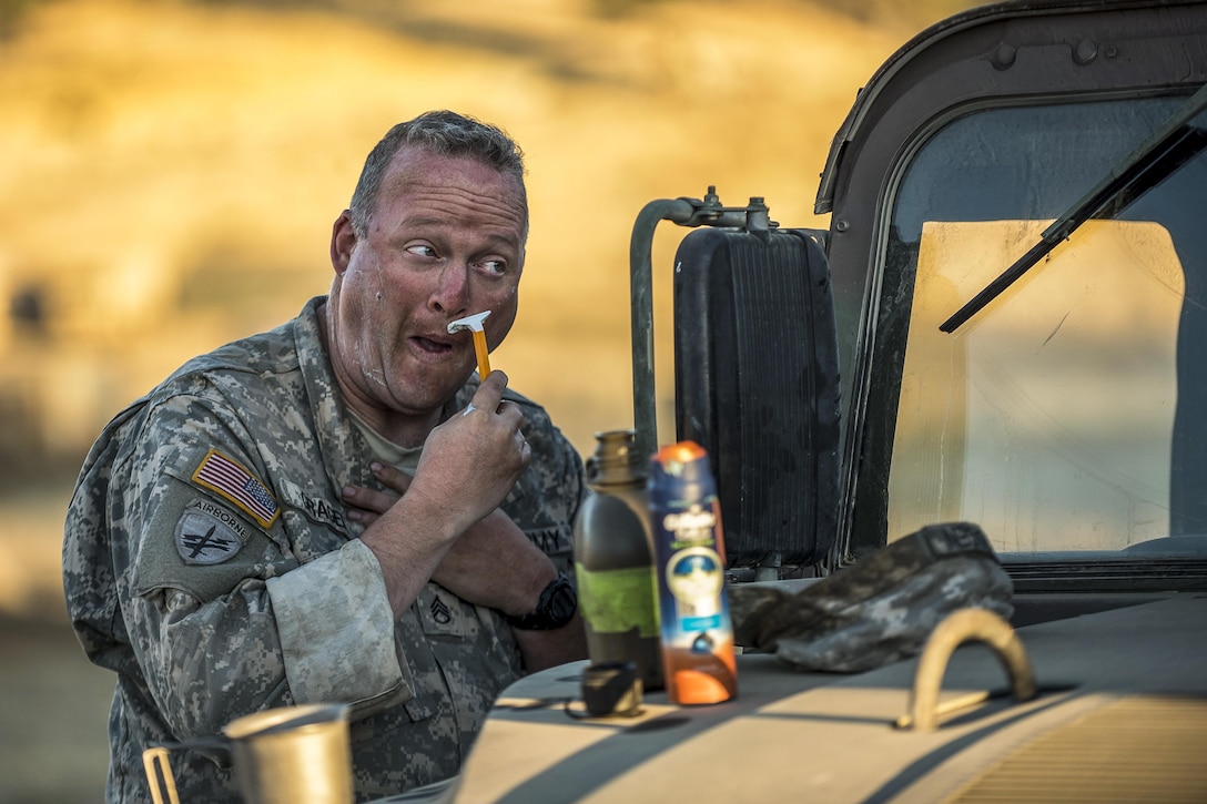 Army Staff Sgt. Jeremy Gragen shaves before participating in a combat training exercise at Fort Hunter Liggett, Calif., July 22, 2017. Gragen is a reservist assigned to the 382nd Military Police Battalion. Army Reserve photo by Master Sgt. Michel Sauret