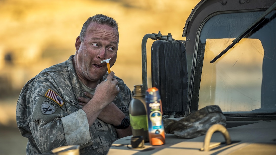 Army Staff Sgt. Jeremy Gragen shaves to prepare for the morning during a combat training exercise at Fort Hunter Liggett, Calif., July 22, 2017. Gragen is a Reserve soldier assigned to the 382nd Military Police Battalion. Army Reserve photo by Master Sgt. Michel Sauret