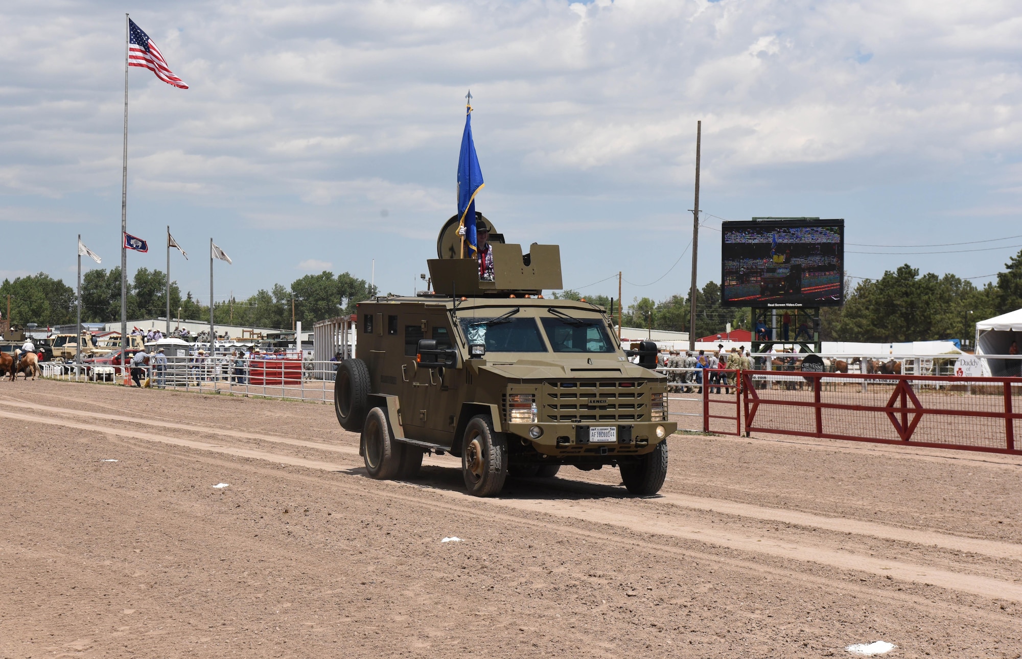 The Air Force flag was carried on a Bearcat vehicle during Military Monday at Frontier Park in Cheyenne, Wyo., July 24, 2017. Each branch of the military was represented by a service member carrying their respective flag in a motorcade procession. This year marks the 150th anniversary of F.E. Warren Air Force Base and the city of Cheyenne. The two communities came together to celebrate during the 121st Cheyenne Frontier Days rodeo and festival. (U.S. Air Force photo by Airman 1st Class Breanna Carter)