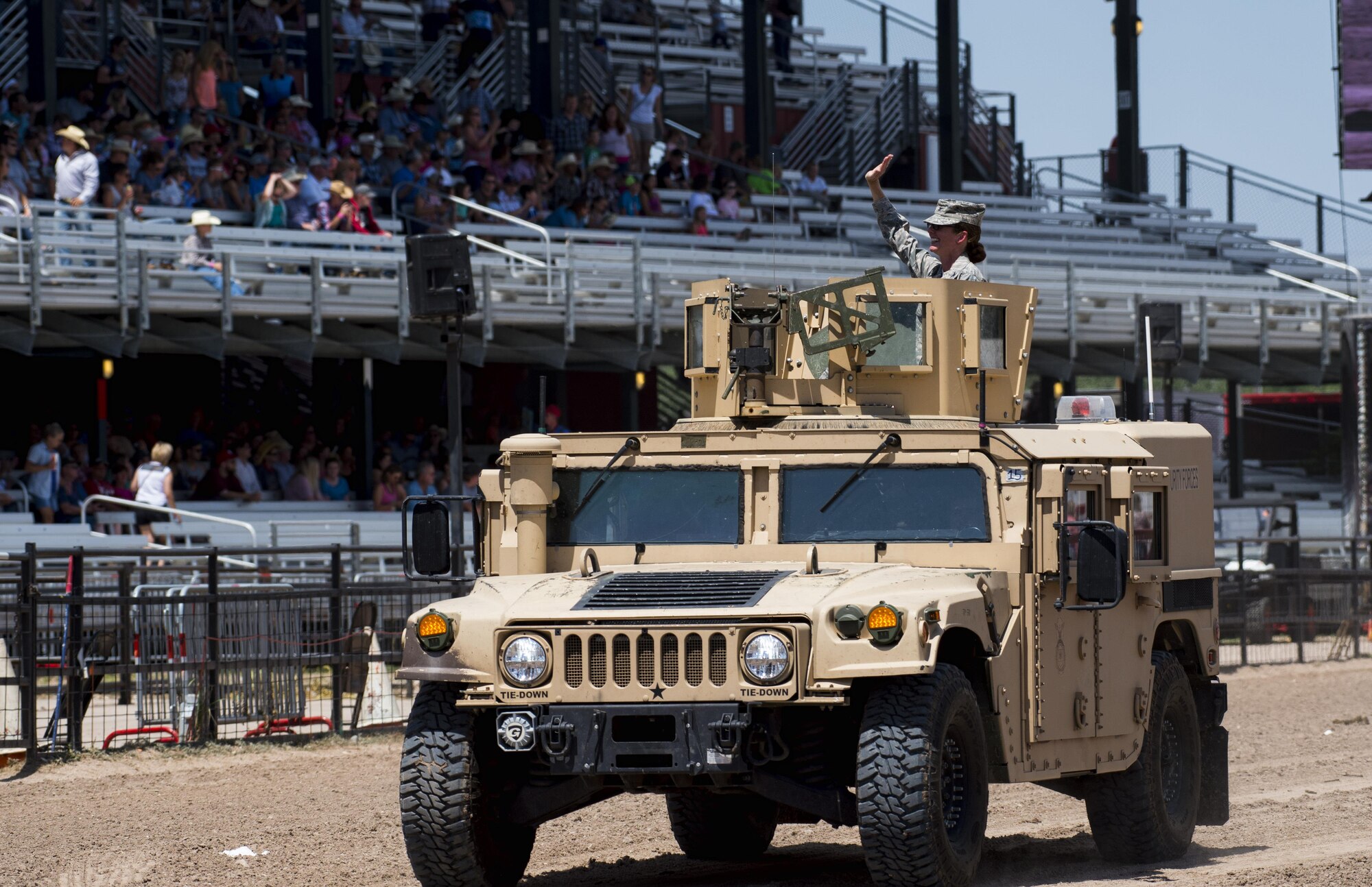 Col. Stacy Huser, 90th Missile Wing commander, greets the crowd during Military Monday at Frontier Park in Cheyenne, Wyo., July 24, 2017. Leadership from local military installations including F.E. Warren Air Force Base were invited to be a part of the Military Monday festivities. This year marks the 150th anniversary of F.E. Warren Air Force Base and the city of Cheyenne. The two communities came together to celebrate during the 121st Cheyenne Frontier Days rodeo and festival. (U.S. Air Force photo by Staff Sgt. Christopher Ruano)