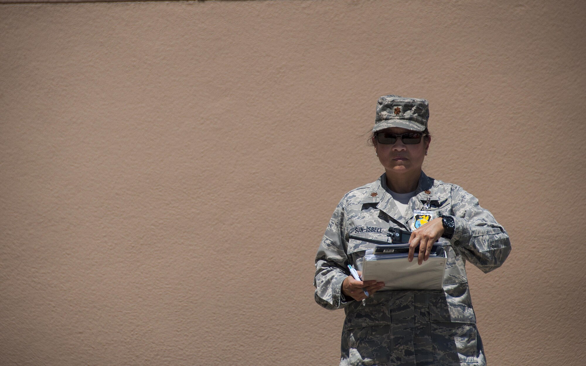 Maj. Theresa Sun-Isbell, 349th Aeromedical Staging Squadron wing inspection team lead, observes members of the ASTS partake in a humanitarian aid scenario as part of Patriot Wyvern at Travis Air Force Base, Cali., on July 22, 2017. The 349th ASTS members had one hour to set up an En-Route Patient Staging Facility and communications. They accomplished their task in less than 30 minutes. (U.S. Air Force photo by Staff Sgt. Daniel Phelps)