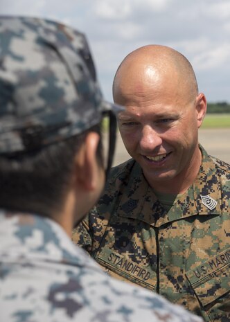 U.S. Marine Corps Sgt. Maj. Joseph Standifird, sergeant major of Marine Fighter Attack Squadron (VMFA) 232, bids farewell to a Japan Air Self-Defense Force (JASDF) service member at JASDF Hyakuri Air Base, Japan, July 21, 2017. The squadron conducted training to enhance proficiency in dissimilar basic fighter section-engaged maneuvers, active air defense and air interdictions, as well as fighter-attack instructor work-ups, and weapons and tactics instructor prerequisites. VMFA-232 hopes to work with Japanese forces in the future in order to foster host-nation partnerships, which in turn forms a more capable alliance.  (U.S. Marine Corps photo by Lance Cpl. Mason Roy)