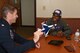 Juan Alonzo speaks with Lt. Col. Kevin Walsh, U.S. Air Force Thunderbirds #7 pilot, before his celebrity flight July 24, 2017, on the Wyoming Air National Guard Base, Cheyenne, Wyo. The flight consisted of basic aerial maneuvers around the surrounding area. (U.S. Air Force photo by 2d Lt. Nikita Thorpe