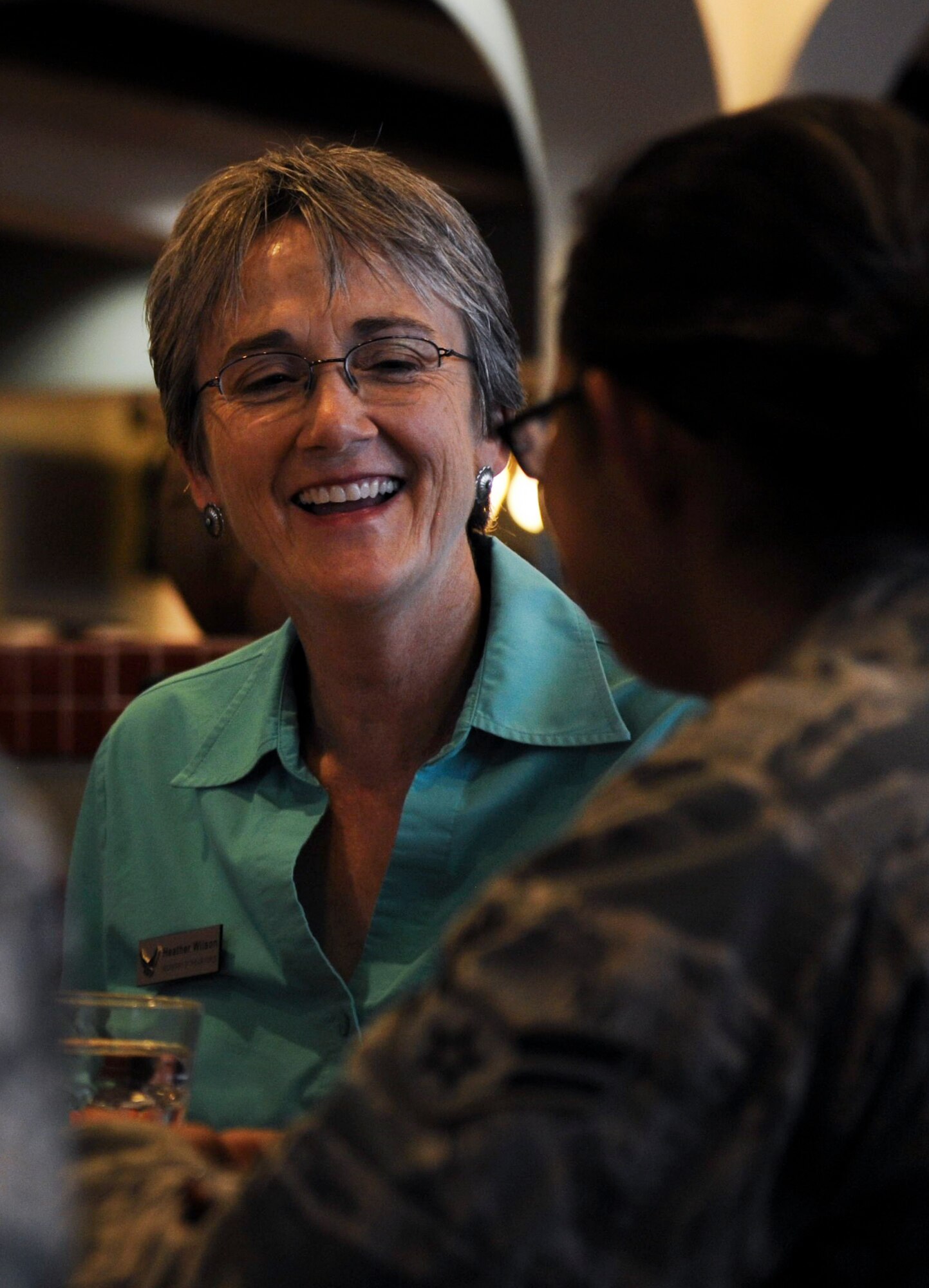 Air Force Secretary Heather Wilson laughs during a lunch with Airmen at the Crosswinds Dining Facility on Nellis Air Force Base, Nevada, July 18, 2017. Wilson was impressed with the skills in which in which Airmen execute the responsibilities the Air Force places on their shoulders. (U.S. Air Force photo by Senior Airman Kevin Tanenbaum)