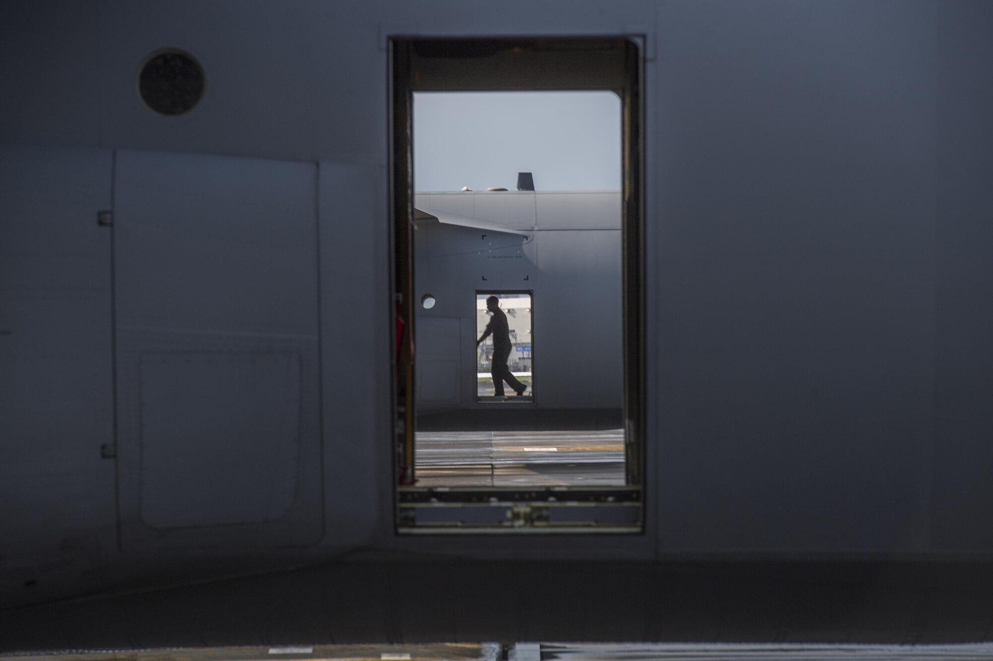 Airman 1st Class Young Achuka, 36th Airlift Squadron C-130J Super Hercules loadmaster, prepares a C-130J to load cargo, July 18, 2017, at Yokota Air Base, Japan. Cargo to be dropped is rigged to ensure the aircrews safety, the cargo properly exits the aircraft and the cargos parachute deploys. (U.S. Air Force photo by Airman 1st Class Donald Hudson)