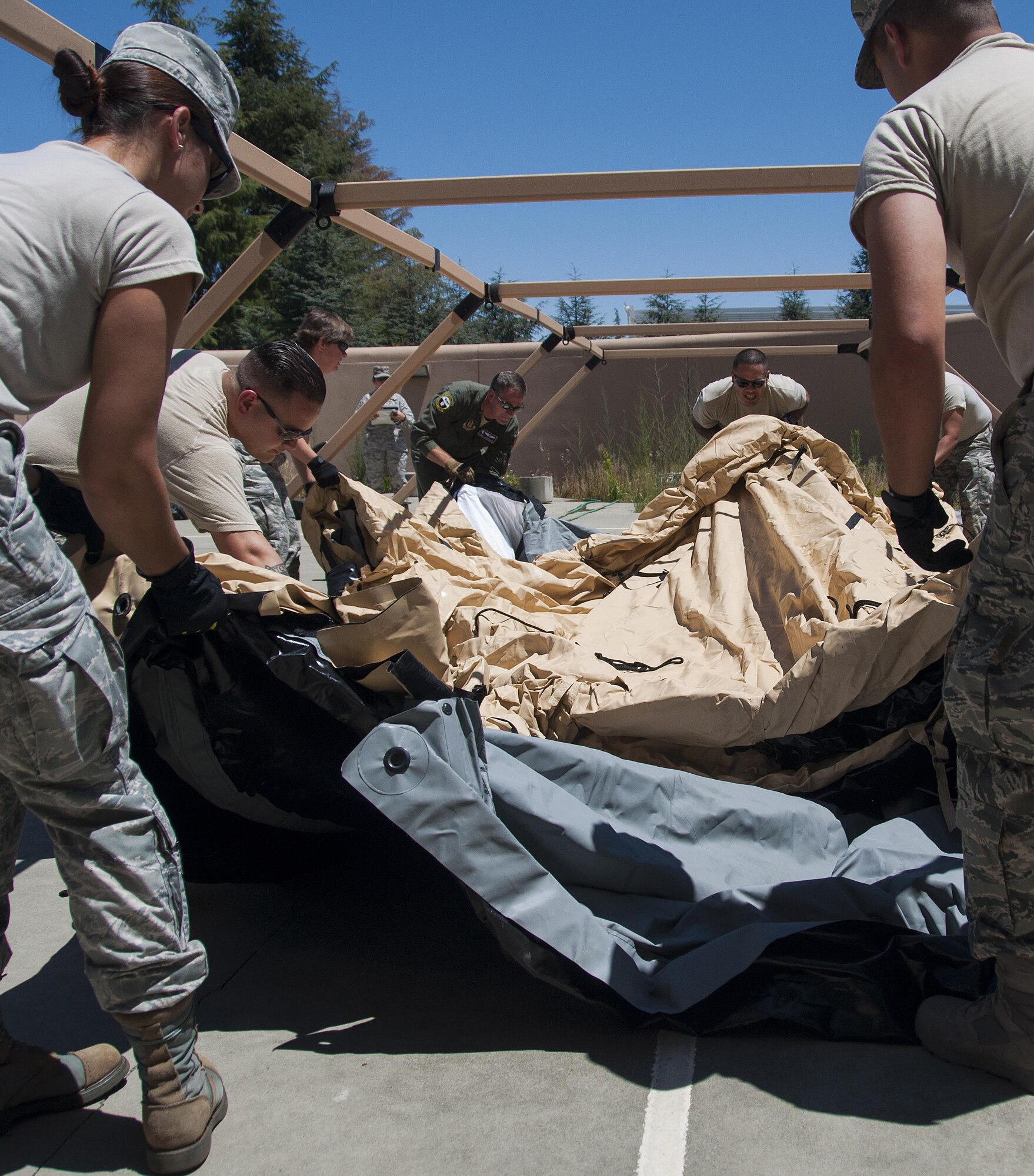 Members of the 349th Aeromedical Staging Squadron put together an En-Route Patient Staging Facility as part of a unit evaluation inspection for Patriot Wyvern at Travis Air Force Base, Cali., on July 22, 2017. The 349th ASTS members had one hour to set up the ERPSF and communications. They accomplished their task in less than 30 minutes. (U.S. Air Force photo by Staff Sgt. Daniel Phelps)
