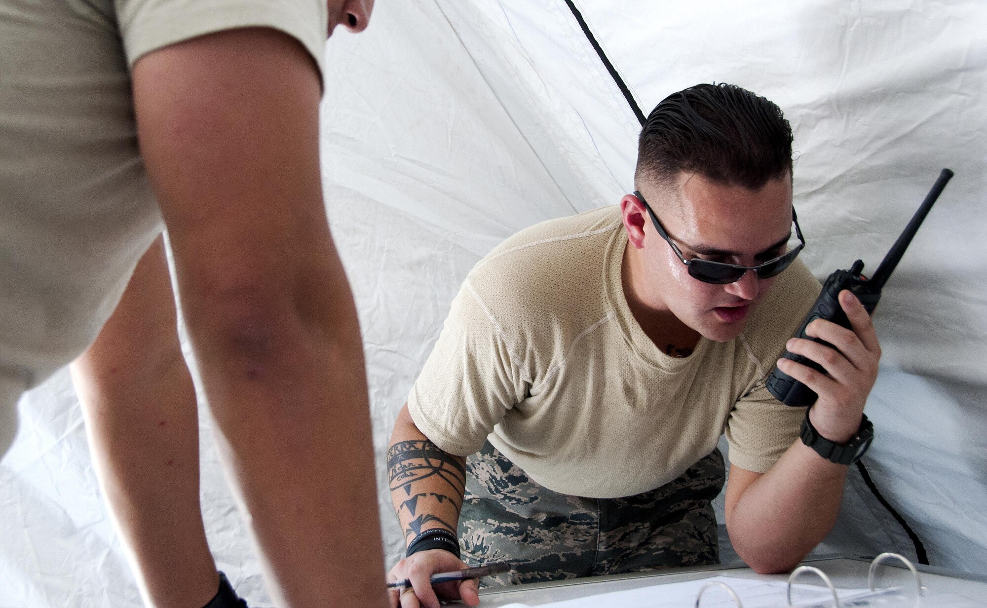 Master Sgt. Joseph Mizer, 349th Aeromedical Staging Squadron logistics technician, sets up radio communications as part of a unit evaluation inspection for Patriot Wyvern at Travis Air Force Base, Cali., on July 22, 2017. The 349th ASTS members had one hour to set up the En-Route Patient Staging Facility and  communications. They accomplished their task in less than 30 minutes. (U.S. Air Force photo by Staff Sgt. Daniel Phelps)