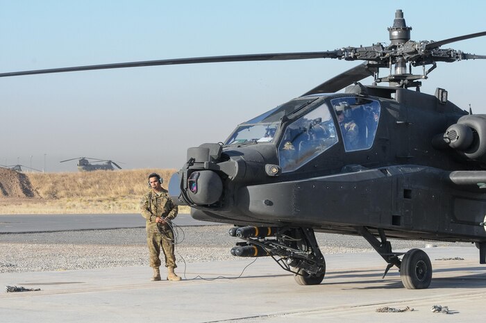ERBIL, Iraq – Spc. Richard Pena, a crew chief assigned to C Troop, 4th Squadron, 6th Cavalry Regiment, Task Force Saber, conducts pre-flight inspections of an AH-64E Apache helicopter at Erbil, Iraq, July 11, 2017. The AH-64E Apache provides reconnaissance and attack capability in the fight against ISIS for Combined Joint Task Force – Operation Inherent Resolve. CJTF-OIR is the Coalition to defeat ISIS in Iraq and Syria (U.S. Army photo by Capt. Stephen James)