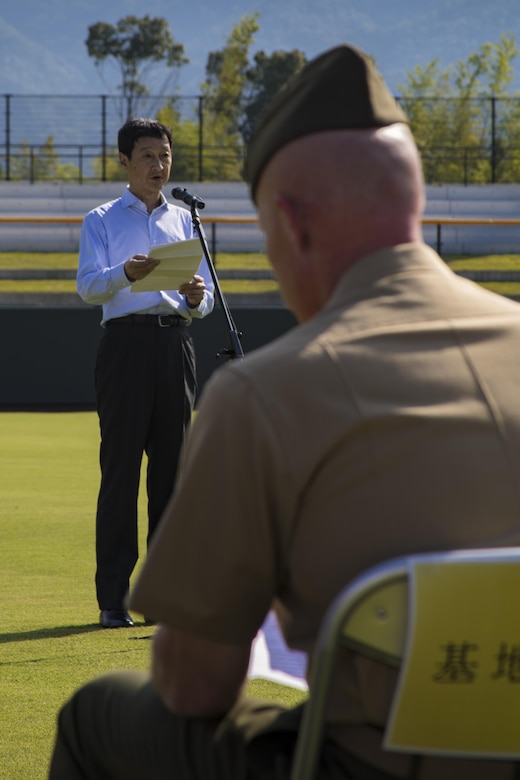 Takahiro Sugawara, director general of Chugoku-Shikoku Defense Bureau, speaks to guests during a scoreboard lighting ceremony at Kizuna Stadium in Iwakuni City, Japan, July 19, 2017. The ceremony offered a private viewing of the almost completed stadium that is to be used by U.S. service members, their families and local Japanese. (U.S. Marine Corps photo by Cpl. Joseph Abrego)