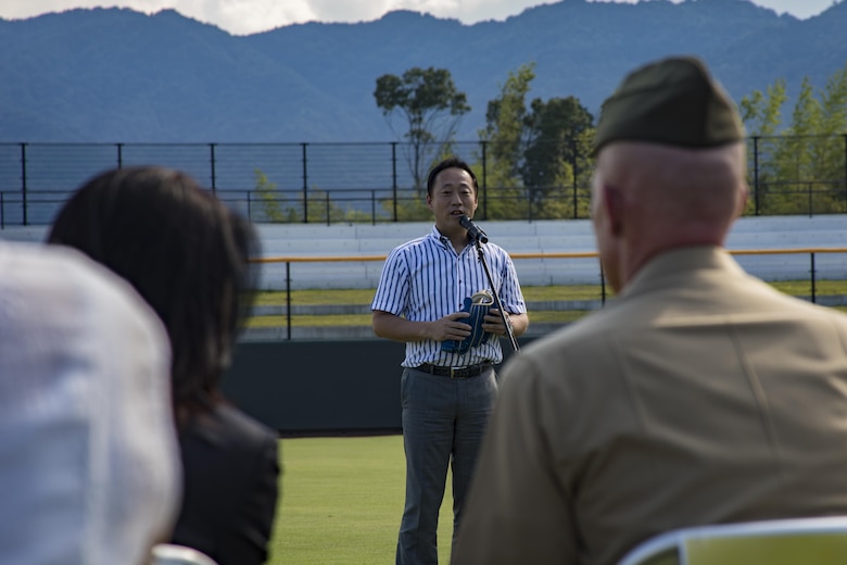 Yoshihiko Fukuda, mayor of Iwakuni City, speaks to guests during a scoreboard lighting ceremony at Kizuna Stadium in Iwakuni City, Japan, July 19, 2017. The ceremony offered a private viewing of the almost completed stadium that is to be used by U.S. service members, their families and local Japanese. (U.S. Marine Corps photo by Cpl. Joseph Abrego)