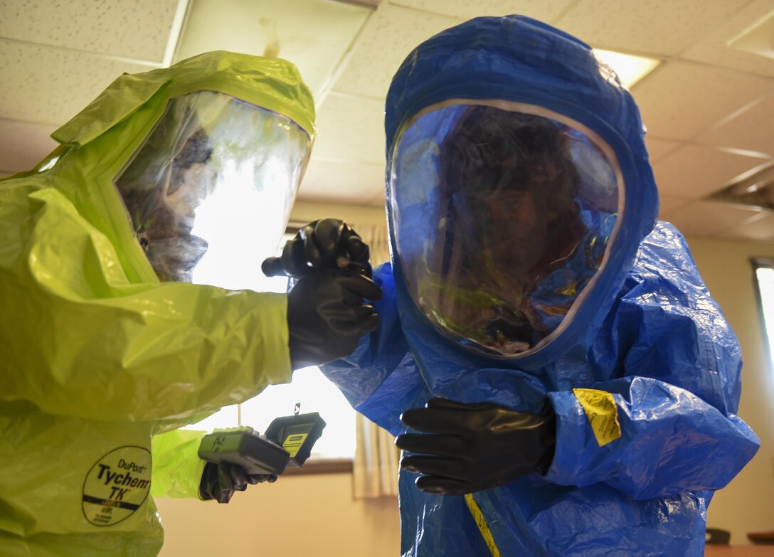 U.S. Air Force Senior Airman Elissa Humphery, 8th Civil Engineer Squadron emergency management journeyman, right, and Staff Sgt. Adam Ruiz, 8th Medical Operations Squadron industrial hygiene noncommissioned officer in charge, fill a vile with an unknown chemical during a joint hazardous material training scenario at Kunsan Air Base, Republic of Korea, July 21, 2017. The 8th CES hosted the training to enhance their ability to operate with their ROKAF counterparts. (U.S. Air Force photo by Senior Airman Michael Hunsaker/ Released)
