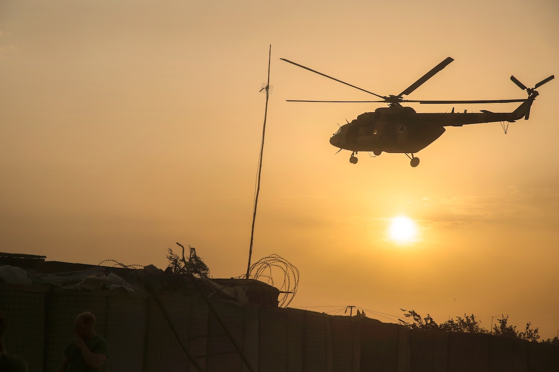 An Afghan MI-17 helicopter flies over Camp Shorserack, Afghanistan, July 15, 2017. The helipoter crew is delivering supplies to Afghan national army soldiers. Marine Corps photo by Sgt. Lucas Hopkins