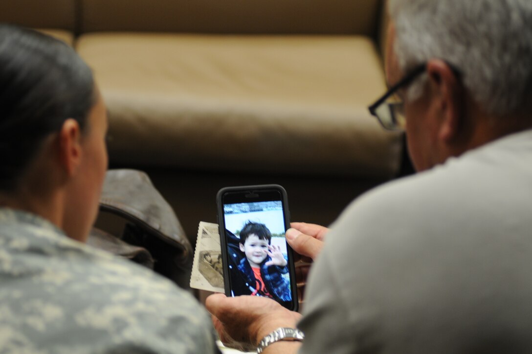 Sgt. Angela Myers, 311th ESC ammunition sergeant, and her Uncle Corey Rose, chat with her son, Zander, on Facetime. This is Myers and her son's first time meeting their uncle and great uncle or any biological family. Myers was raised in foster care.