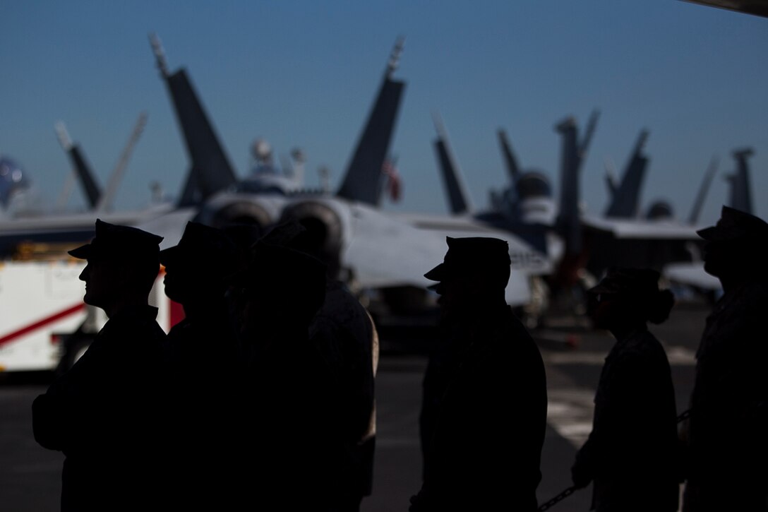 Service members from several partner nations watch the closing ceremony of Exercise Talisman Saber 17 aboard the USS Ronald Reagan (CVN 76), ported in Brisbane, Queensland, Australia, July 25, 2017. Talisman Saber is a biennial exercise designed to improve the interoperability between Australian and U.S. forces. The 31st MEU is taking part in Talisman Saber 17 while deployed on a regularly-scheduled patrol of the Indo-Asia-Pacific region.