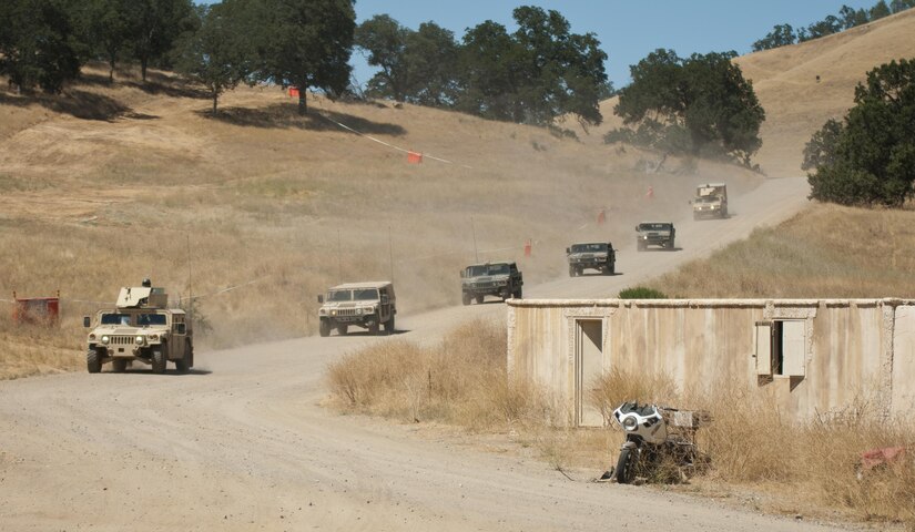 A column of vehicles from the 344th Military Police Company, 485th Chemical Battalion, and 382nd Military Police Battalion approach the small mock village of Niscoln on Fort Hunter Liggett, Calif., during training on July 20, 2017. The Soldiers were later attacked by troops from the 96th Military Police Company, 96th Military Police Battalion. The military police were roleplaying as attackers to increase the training value for other forces. Nearly 5,400 service members from the U.S. Army Reserve Command, U.S. Army, Army National Guard, U.S. Navy, and Canadian Armed Forces are training at Fort Hunter Liggett as part of the 84th Training Command’s Combat Support Training Exercise 91-17-03 and ARMEDCOM’s Global Medic; this is a unique training opportunity that allows U.S. Army Reserve units to train alongside their multi-component and joint partners as part of the America’s Army Reserve evolution into the most lethal Federal Reserve force in the history of the nation. (U.S. Army Reserve photo by Sgt. David L. Nye, 301st Public Affairs Detachment)