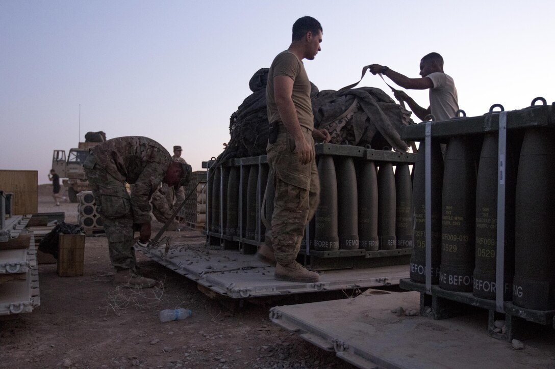 Paratroopers, with Charlie Battery, 2nd Battalion, 319th Airborne Field Artillery Regiment, 82nd Airborne Division, work late into the evening preparing munitions for movement at Forward Operating Base Shalalot, Iraq, July 6, 2017. The fuel, ammunition and life support essentials needed to sustain the fight against ISIS in the U.S. Army Central Command area of operations are provided by U.S. Army Reserve Soldiers from the 316th Sustainment Command (Expeditionary), acting as the 1st Sustainment Command (Theater) Operational Command Post, in Camp Arifjan, Kuwait. The 1st TSC has provided approximately 22 million rounds of ammunition, nearly 3 million gallons of fuel, over 1,000 vehicles,  nearly 400 million gallons of water and more than 13,000 weapons. (U.S. Army Photo by Sgt. Christopher Bigelow)