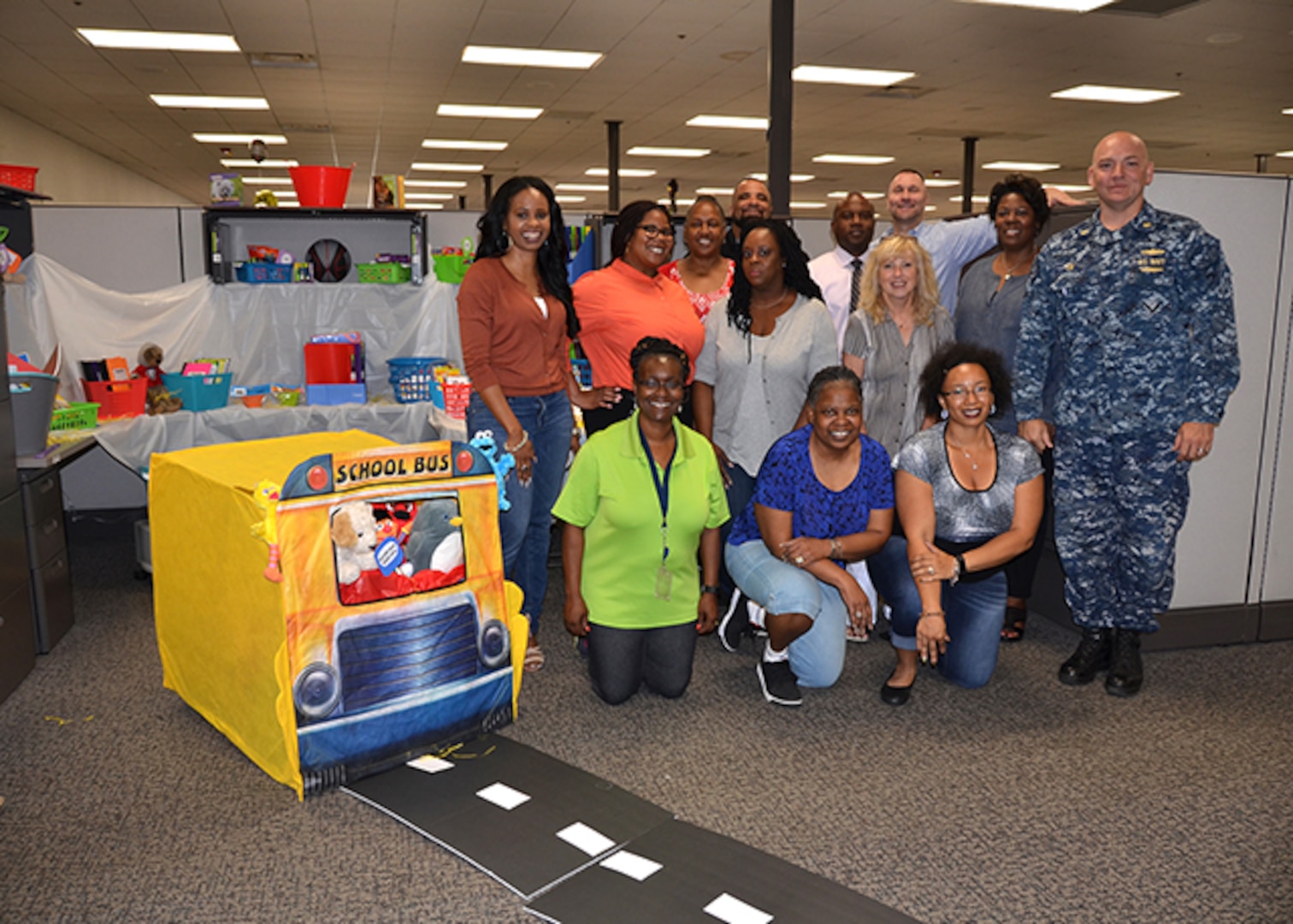 The School Team, made up of employees from DLA Aviation Supplier Operations and Planning Process Directorates, poses with their display June 7, 2017. The temporary team, formed to build morale and comradery, collected supplies for Baker Elementary School in Henrico County, Virginia.  The school closed after a fire last year and will reopen this fall. 
