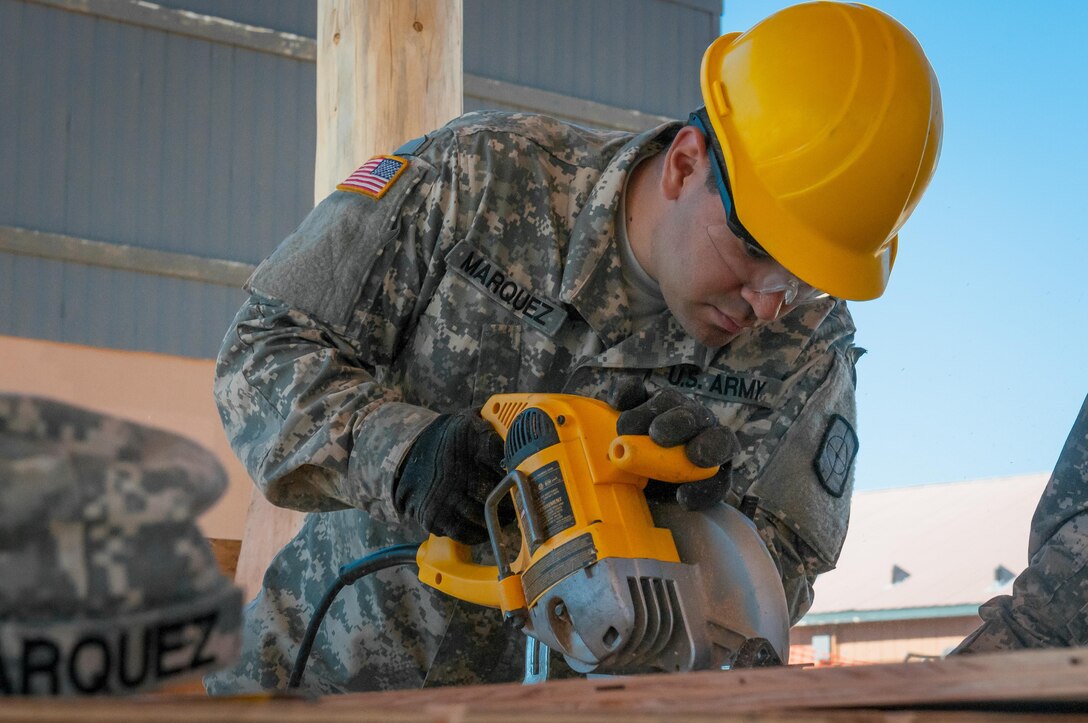 U.S. Army Reserve Spc. David Marquez, a plumber with the 994th Engineer Company out of Denver, Colorado, works with the team to construct a large storage shed at the YMCA of the Rockies - Snow Mountain Ranch, in Granby, Colorado, July 20, 2017. (U.S. Army Reserve photo by Spc. Miguel Alvarez, 354th Mobile Public Affairs Detachment)