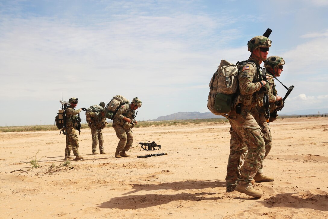 Soldiers move to a landing zone where they will receive equipment delivered by a CH-47 Chinook helicopter as part of slingload operations during training at Fort Bliss, Texas, July 23, 2017. The soldiers are assigned to the 101st Airborne Division (Air Assault), 2nd Brigade Combat Team. Army photo by Command Sgt. Maj. Thomas Clement