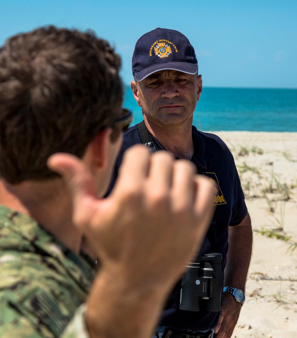 A U.S. Naval Special Warfare Command operator briefs Vice Adm. Ihor Voronchenko, commander of the Ukrainian navy on Tendra Island, Ukraine, at exercise Sea Breeze 17, July 19, 2017. Special Operations Command Europe photo by Army Spc. Jeffery Lopez