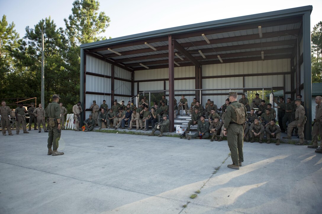 Marines assigned to Alpha company, 2nd Tank Battalion, 2nd Marine Division receive a safety briefing before engaging in drills during exercise Iron Wolf 17 at Camp Lejeune, N.C., July 15, 2017. Iron Wolf 17 is a multiunit exercise designed to simulate combat zone conditions Marines may face while on deployment. Marine Corps photo by Lance Cpl. Angel Travis