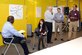 Madeline Riggs (center),19, a help desk technician and student at Red Rocks Community College, speaks to the audience at the CyberWorx Design Sprint, July 20, 2017, at the U.S. Air Force Academy. The Design Sprints hosted by the Academy promote cyber innovation and exploit the Air Force’s partnership with its academic and tech-transfer partners. Riggs participated in a group skit highlighting the abilities of women in the IT field. (U.S. Air Force photo/Darcie Ibidapo) 