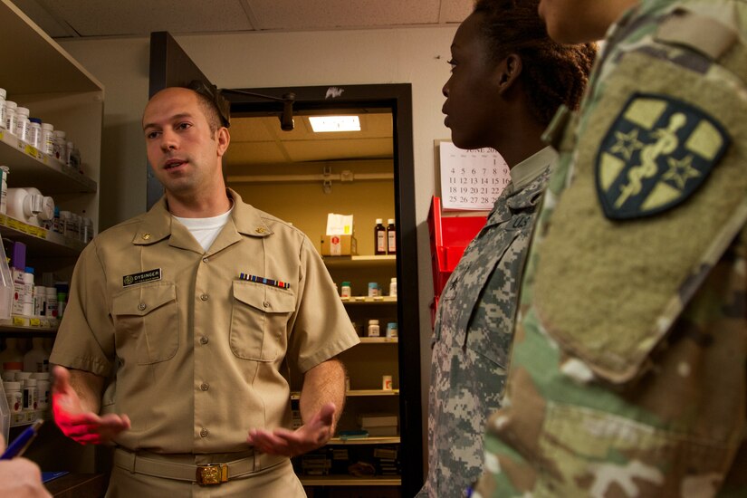 US Public Health Service Lt. Cmdr. Cole Dysinger, a pharmacist at the at the Verne E. Gibbs Clinic at Poplar, Montana, informs the incoming Soldiers of the 7239th Medical Support Unit, Chattanooga, Tennessee, about the facilities and procedures as they begin their Fort Peck Innovative Readiness Training July 17, 2017. During the two-week-long mission, medical and dental care will be provided to an estimated population of over 8,000 residents.(U.S. Army Reserve photo by Spc. Claudia Rocha 345th Public Affairs Detachment)