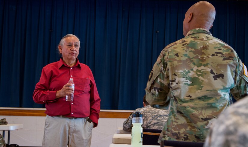 Albert Foote Sr., an elder Native American from Poplar, Montana, invited by the Fort Peck Indian Health Service to give a cultural briefing and welcome Soldiers of the 7239th Medical Support Unit, Chattanooga, Tennessee. He briefed them about the local residents’ culture and traditions as they begin their Innovative Readiness Training at the Verne E. Gibbs Clinic at Poplar, July 17, 2017. The mission is a civil-military program that builds a mutually beneficial partnership between U.S. communities and the Department of Defense to meet training and readiness requirements for Active, Guard and Reserve service members while addressing public and civil society needs. (U.S. Army Reserve photo by Spc. Claudia Rocha 345th Public Affairs Detachment)